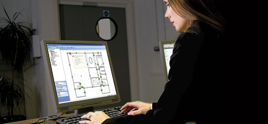 Woman using Net2 software.